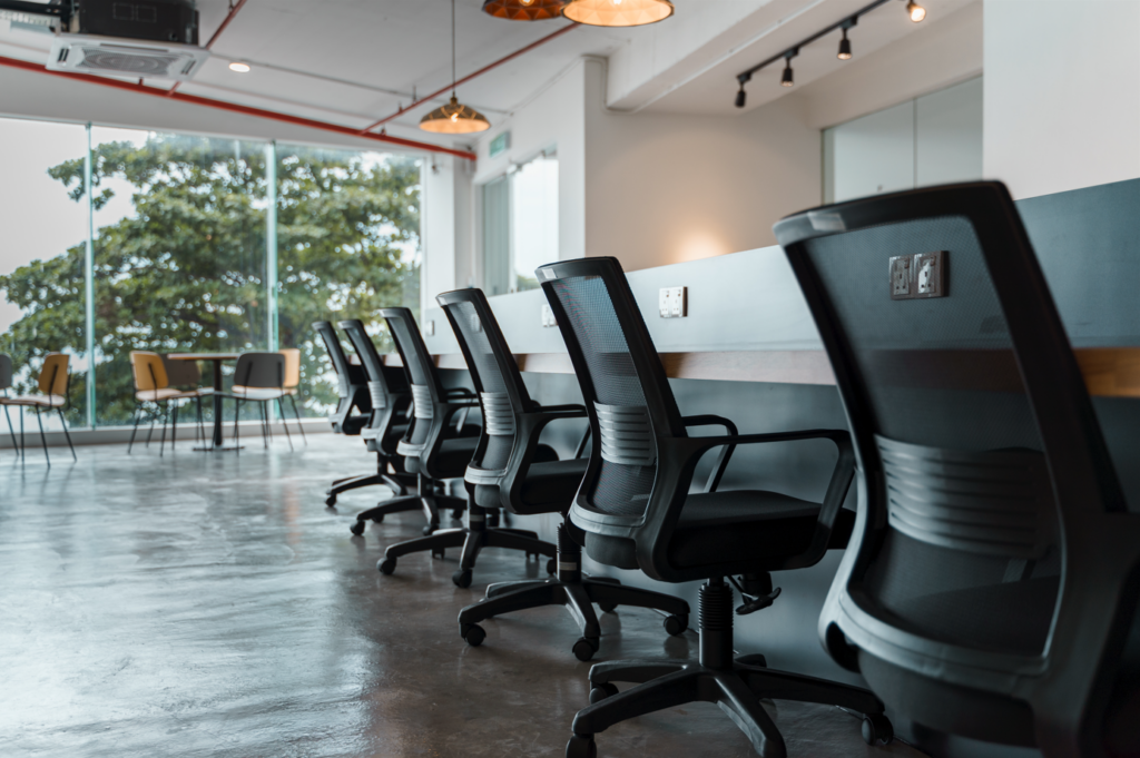 Office ergo chair along a long working table at a co-working space